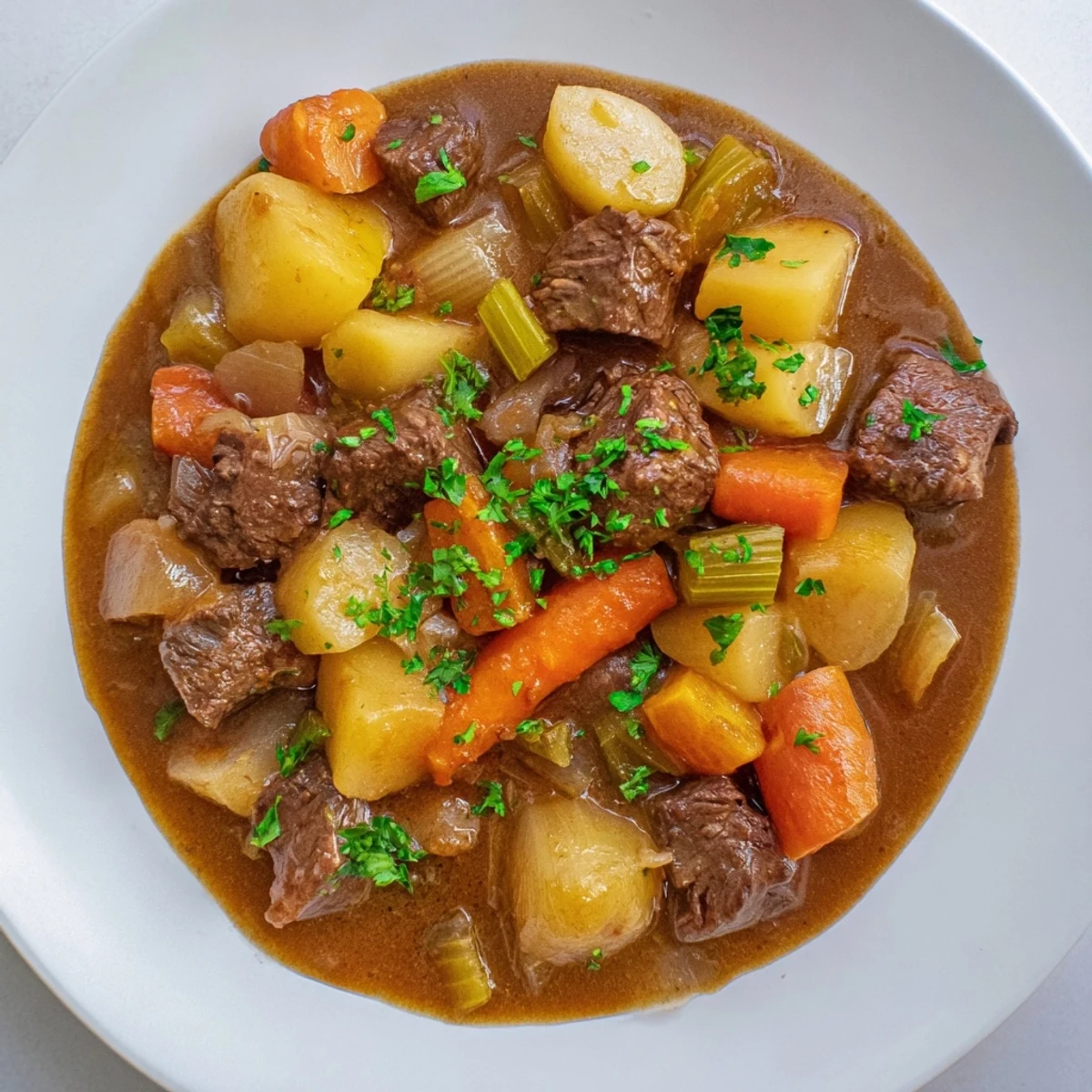 Steaming slow cooker beef stew overflowing with tender beef and colorful root vegetables, ready to serve.