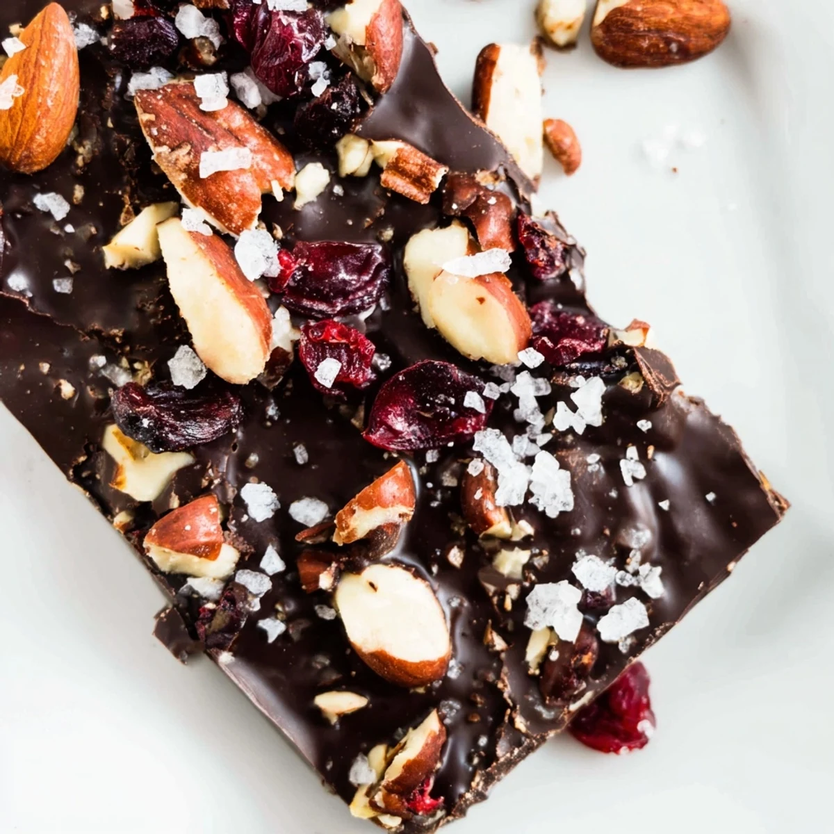 Homemade Chocolate Bar with Nuts displayed on a marble countertop, ready to serve as an indulgent dessert or snack.