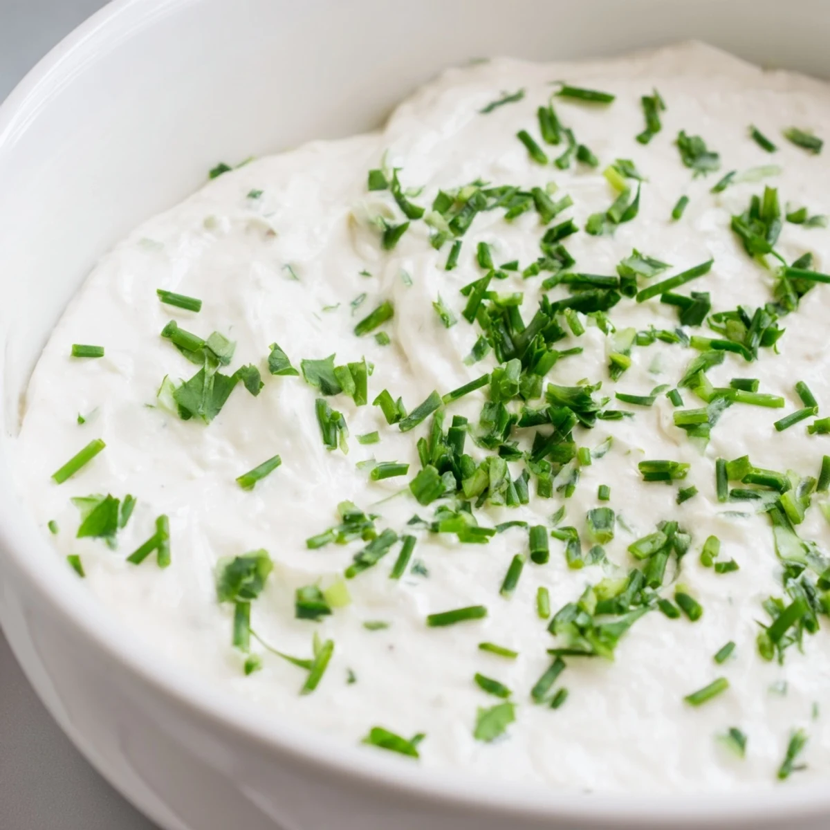 Spoon a scoop of this savory Creamy Snack Dip onto a gluten-free cracker for an easy appetizer.