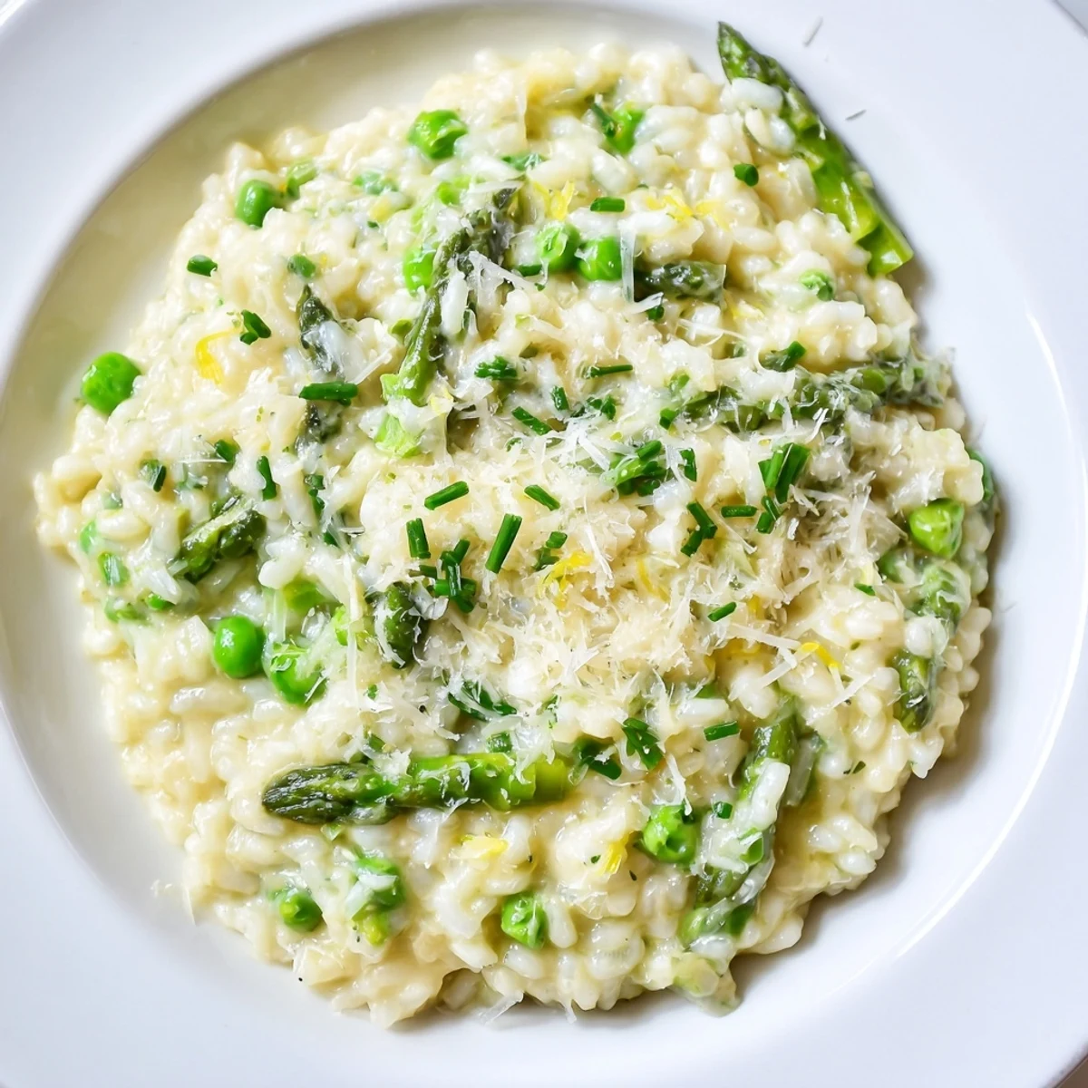 This Creamy Spring Pea and Asparagus Risotto features tender green vegetables nestled in velvety rice.