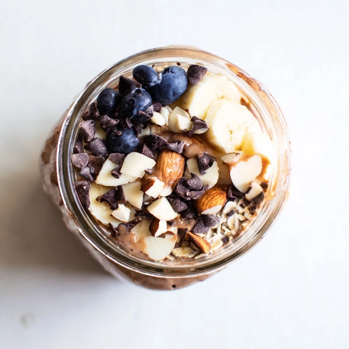 A close-up of Ultimate Healthy Chocolate Overnight Oats with Greek yogurt and chia seeds in a cozy morning setting.