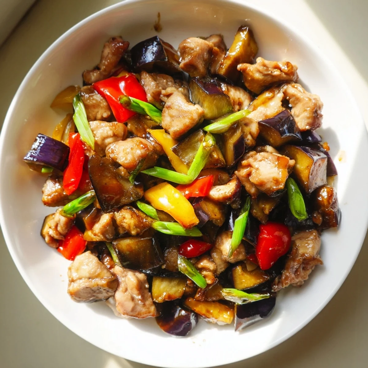 Close-up of Black Vinegar Chicken with Bell Peppers and Eggplant highlights silky eggplant and crisp peppers.