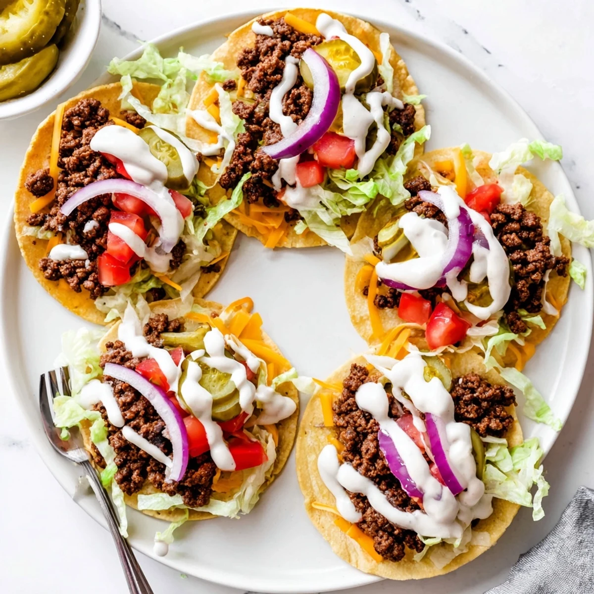 Golden tortilla topped with juicy seasoned beef patty, American cheese, lettuce, and zesty special sauce