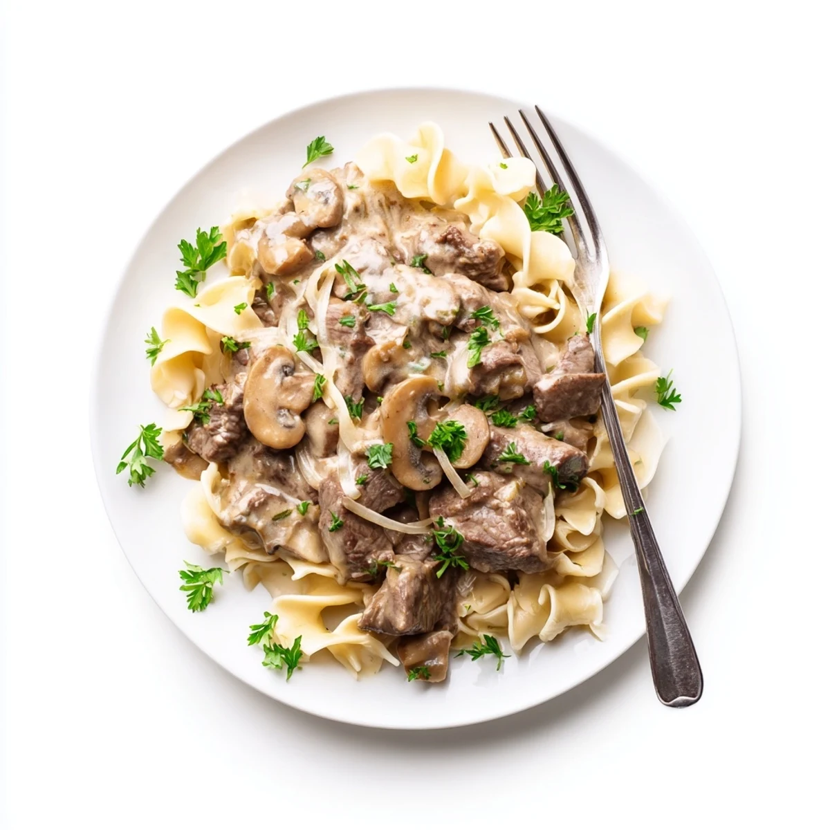 Classic beef stroganoff featuring rich mushroom sauce and beef served over steaming rice