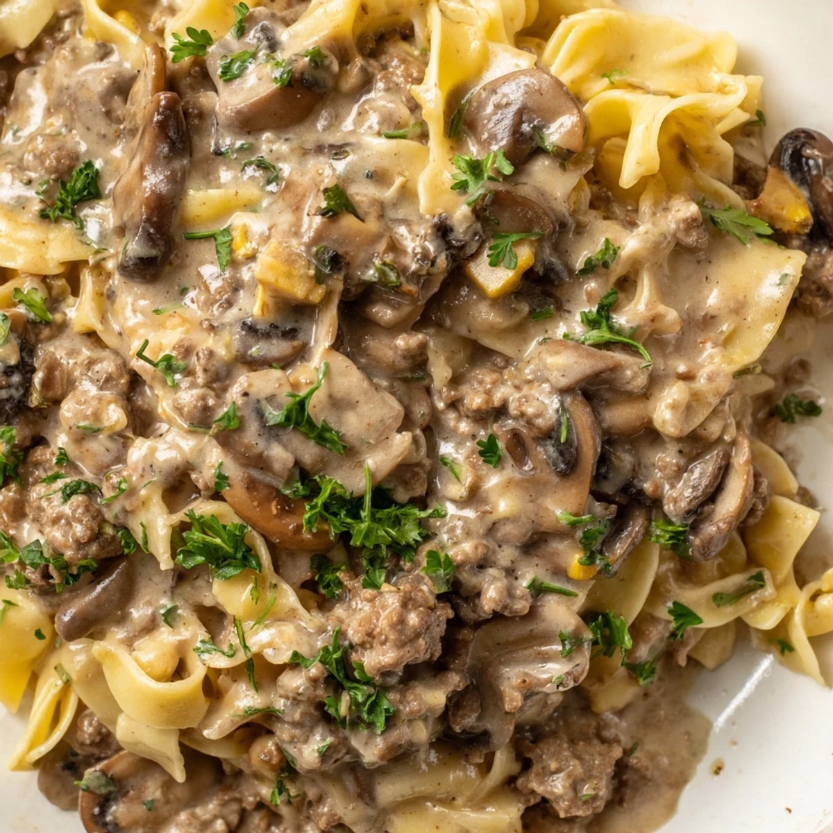Hearty hamburger stroganoff with savory ground beef and silky sauce over noodles
