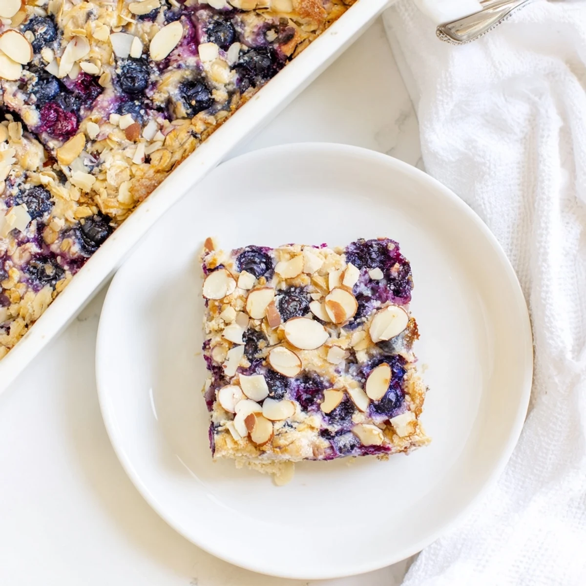 Golden blueberry cottage cheese breakfast bake with juicy berries bubbling through a tender oatmeal crust
