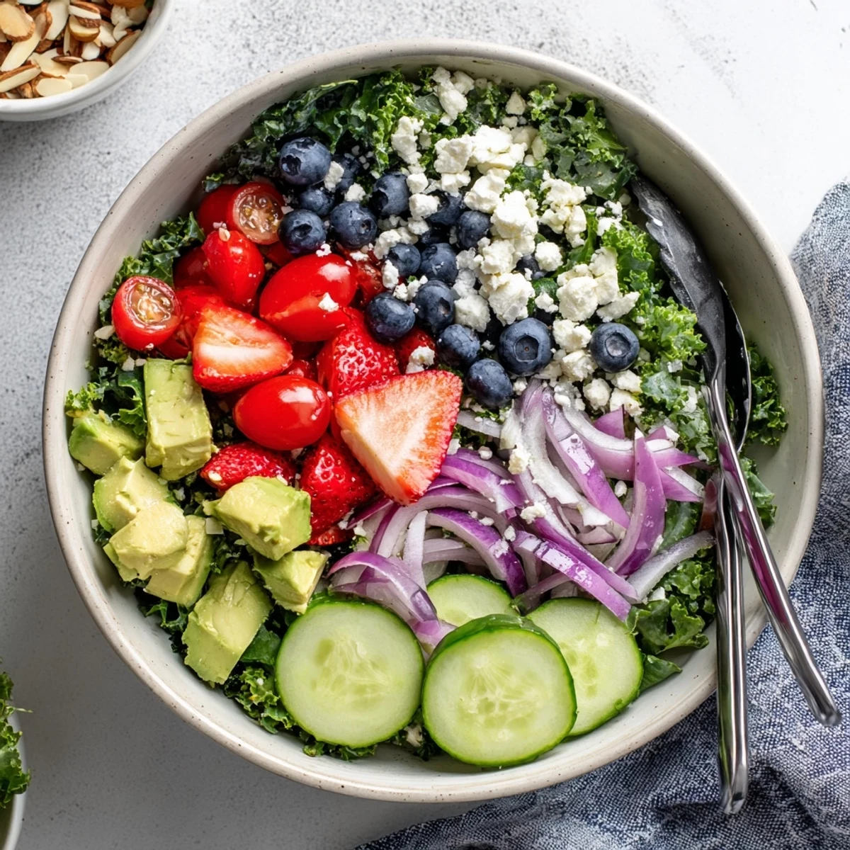 A vibrant summer kale salad drizzled with lemon-honey vinaigrette in a bowl