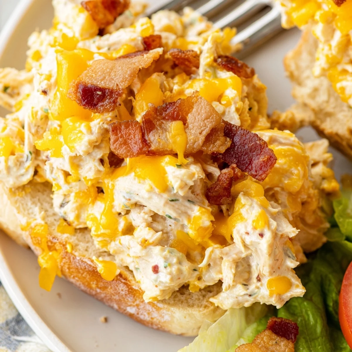 Warm Crack Chicken Sandwiches spooned from baking dish, gooey cheddar, crumbled bacon