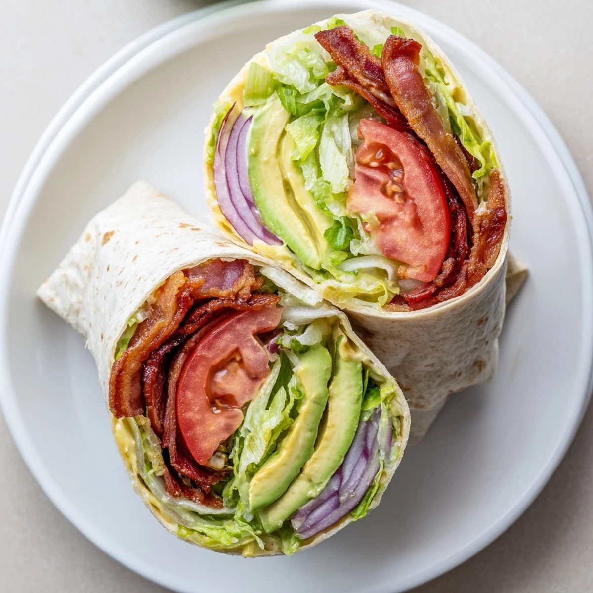Meal Prep BLT Wraps with crispy bacon, ripe tomato, and crunchy romaine
