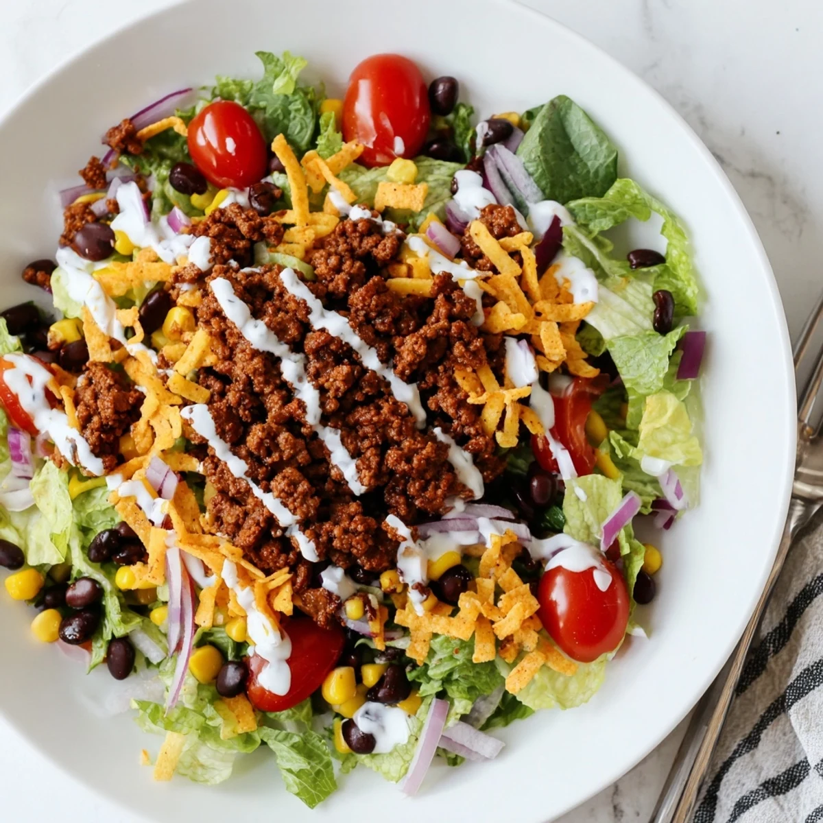 Simple Doritos Taco Salad served immediately, crunchy chips, creamy ranch, fresh romaine