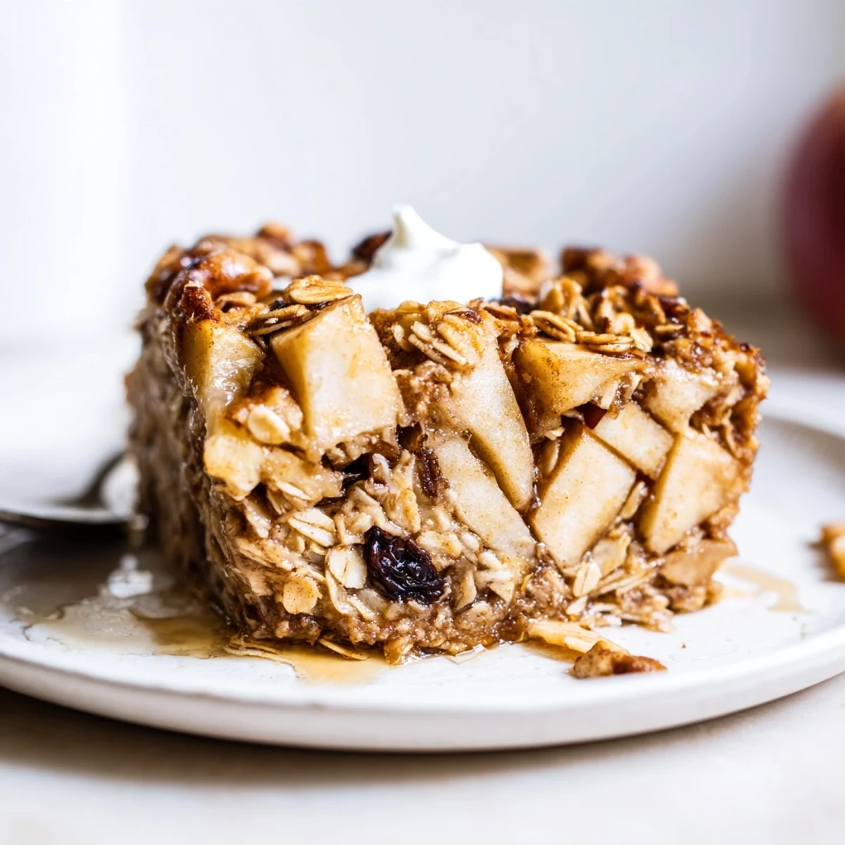 Slices of warm Delicious Apple Cinnamon Oatmeal Bake served with milk.