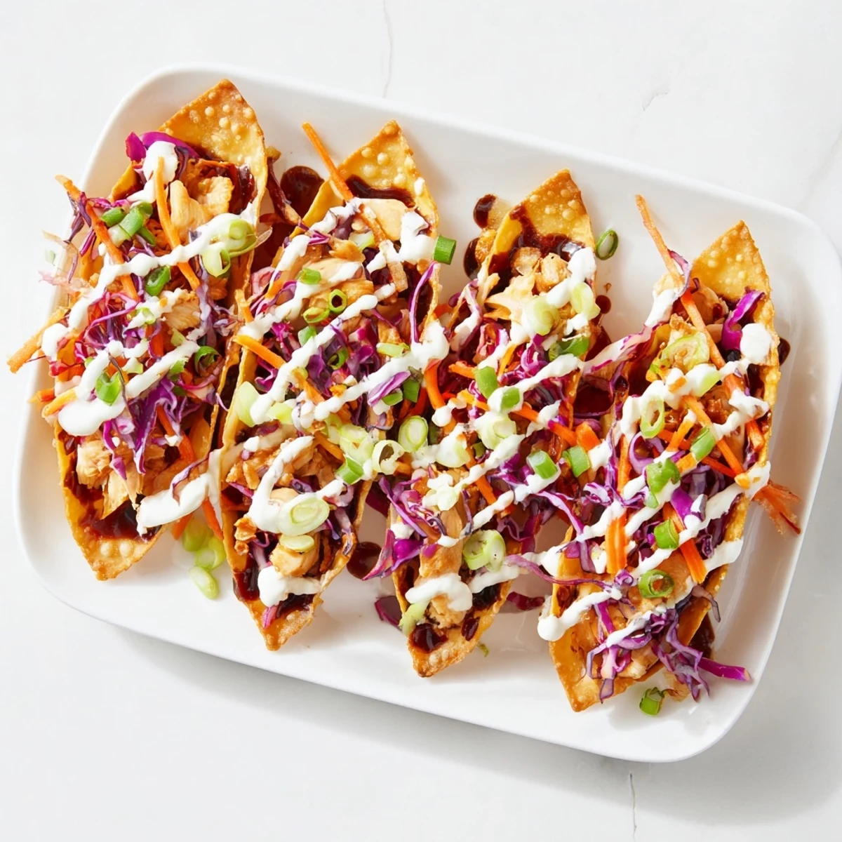 Crispy baked wonton shells filled with seasoned chicken and fresh tangy vegetable slaw